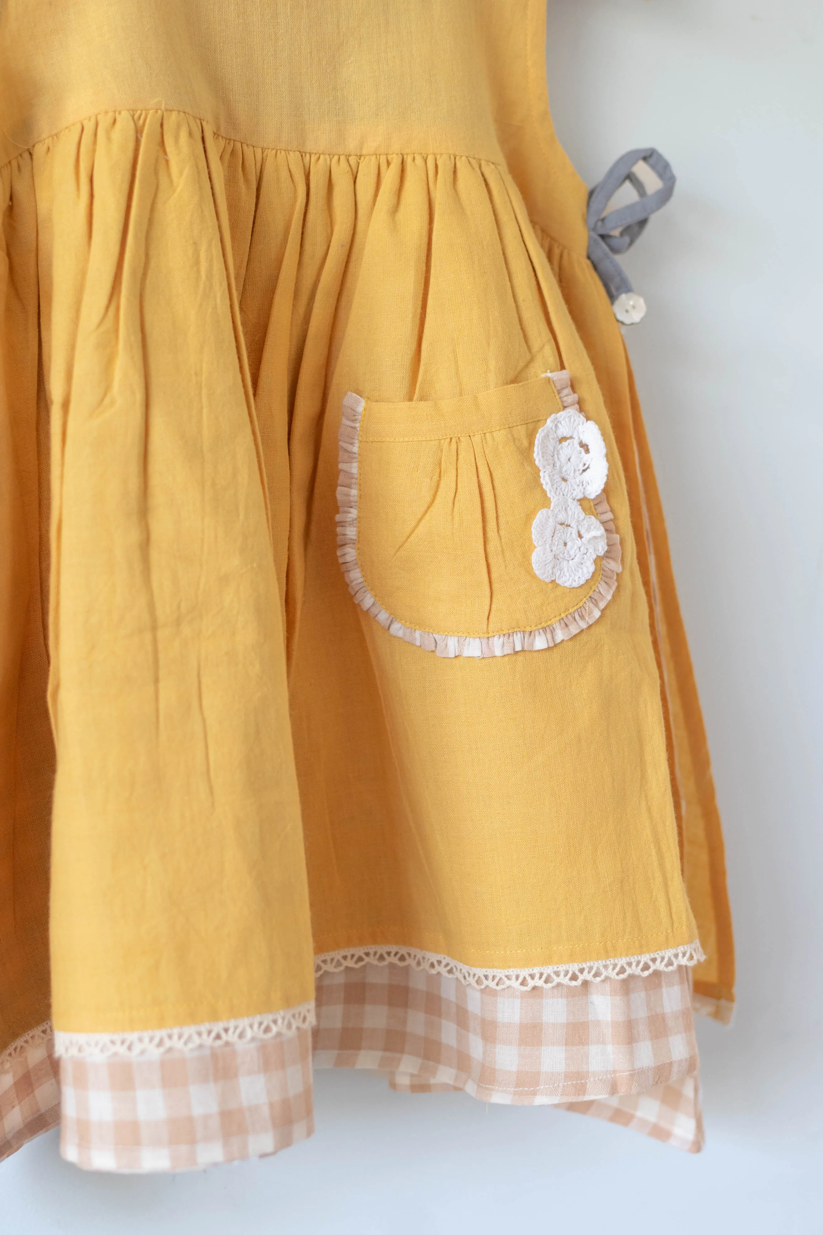 Old photographs sleeveless layered pinafore dress in yellow handwoven cotton