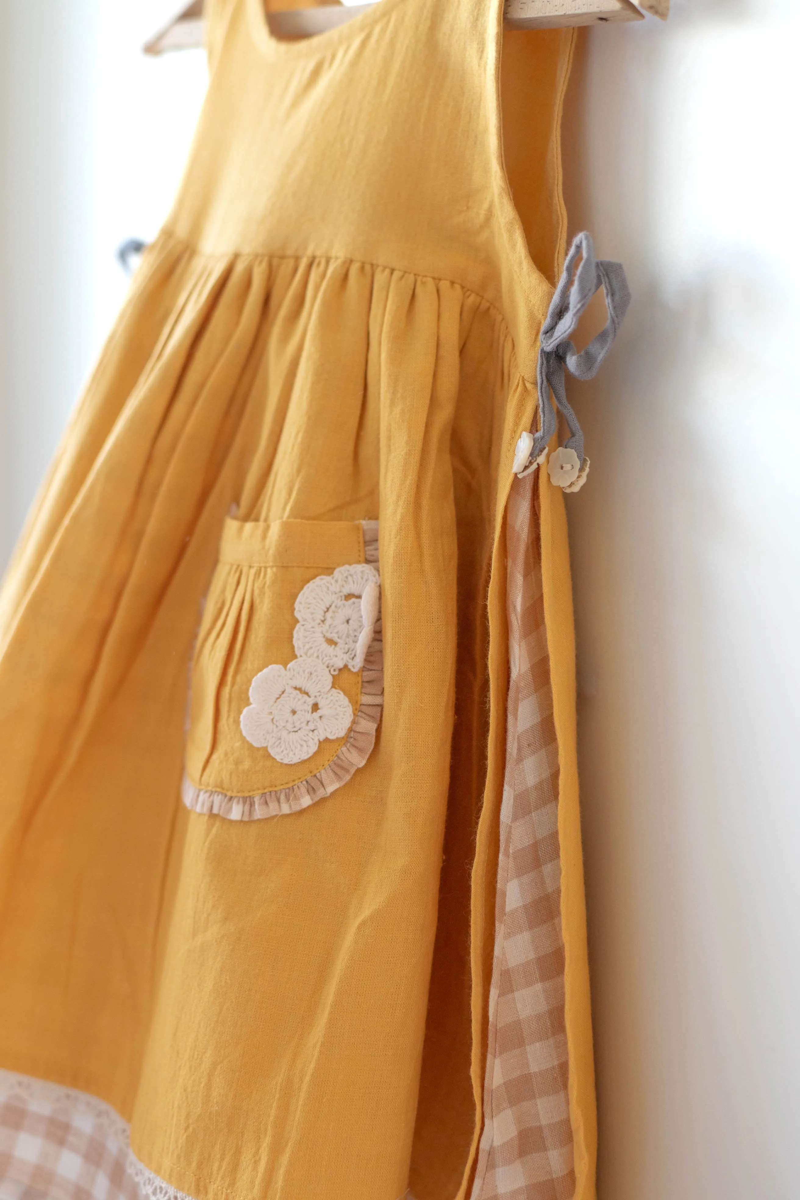 Old photographs sleeveless layered pinafore dress in yellow handwoven cotton