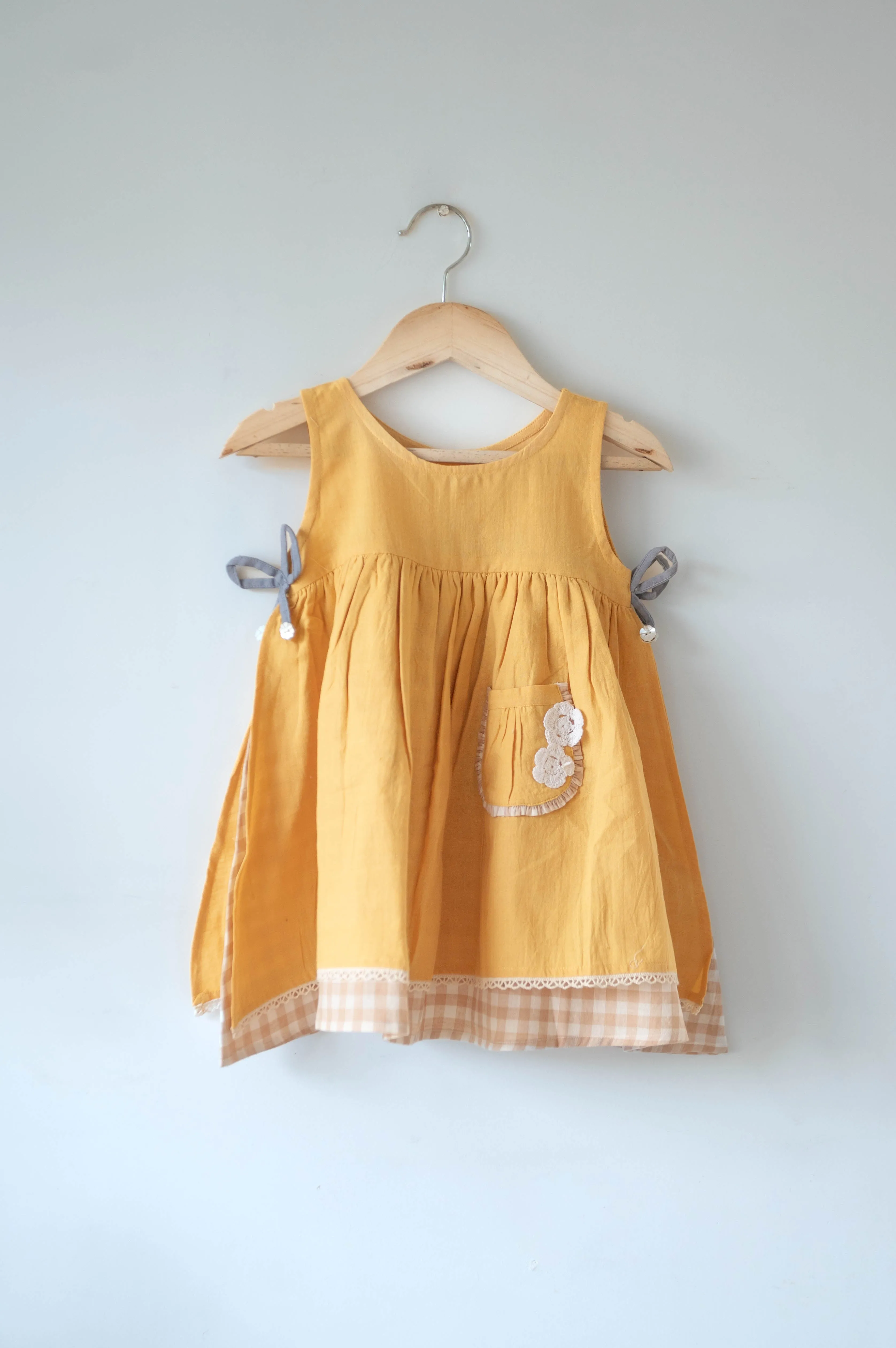 Old photographs sleeveless layered pinafore dress in yellow handwoven cotton